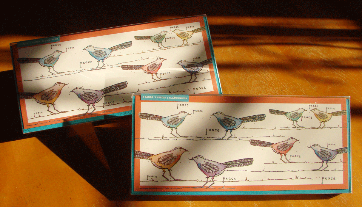 Photo of card sets featuring flittering, twittering birds and a message of peace.